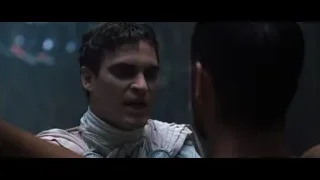 young man's face in dimly lit room — Gladiator