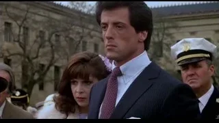 man in suit and woman with military — Rocky III