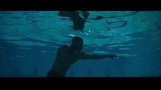 man in a swimming pool — Creed 2