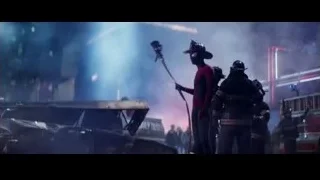 Man in red suit by burning car — The Amazing Spider Man 2