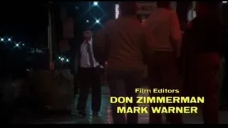 man walking on wet street at night — Rocky III