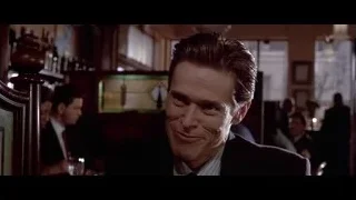 man in suit in dimly lit room — American Psycho