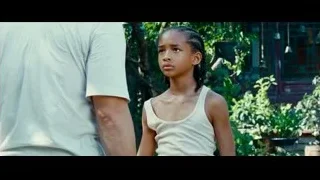 young girl standing in front of man and building — The Karate Kid