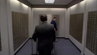 Man in suit walking in hallway — Breaking Bad