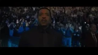 man speaking at podium in Barclays Center — Creed 2