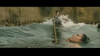 man in water holding spear in battle — Gladiator 2