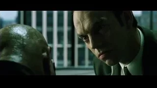 man with serious expression in cityscape — The Matrix
