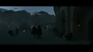 people around campfire in ancient city — Gladiator 2