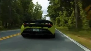 yellow sports car driving on tree-lined road — Sports Cars