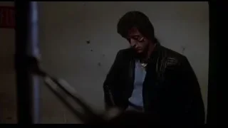 man standing in dimly lit abandoned room — Rocky III