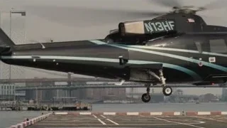 black helicopter flying over city skyline — Succession