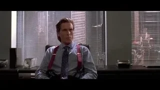 man in office sitting at desk — American Psycho