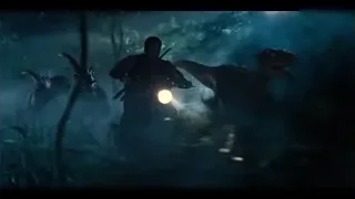 people on motorcycle in forest with dinosaur — Jurassic World