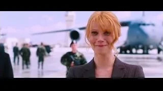 Woman in suit with soldiers and helicopter — Iron Man