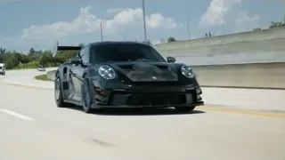 Black sports car driving on highway — Sports Cars