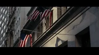 American flags on building with snow — Batman: The Dark Knight Rises