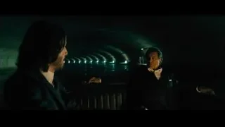 Man in suit thoughtful expression — John Wick: Chapter 4