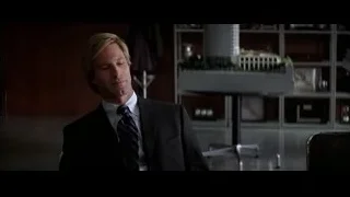 man in suit sitting at office desk — Batman: The Dark Knight