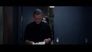 man and woman in dimly lit hallway — Steve Jobs