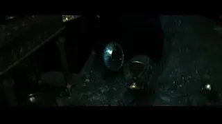Person playing guitar in dark room — Harry Potter and the Deathly Hallows 2