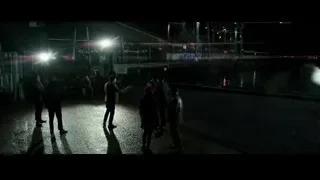People walking on wet pavement in industrial area — Bruce Lee: Birth of The Dragon