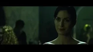 Woman in strapless dress in dim room — The Matrix