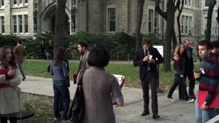 Group of people in front of college building — Suits