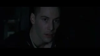 man with serious expression in dark room — The Matrix