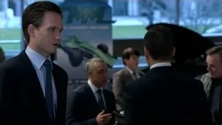men in suits in office with car engine — Suits