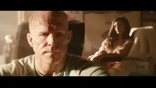 Bald man and woman conversing on couch — Deadpool 2