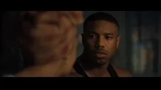 Three men conversing in boxing ring — Creed 2