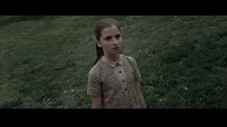 Young girl standing in grassy field — Harry Potter and the Deathly Hallows 2