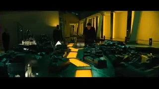 Two men viewing city model in futuristic room — John Wick: Chapter 4