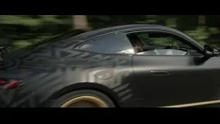 Black sports car driving in forest — F1