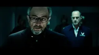 bald man with glasses in dimly lit room — Superman: Man of Steel