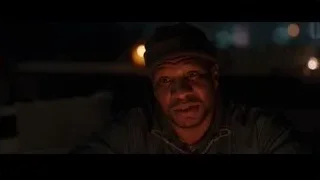 man in beanie and hoodie in city at night — Creed 3