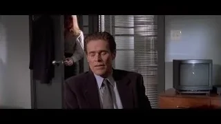 Man in suit sitting in room — American Psycho
