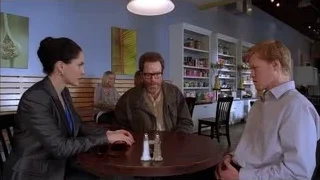 three people conversing at restaurant table — Breaking Bad