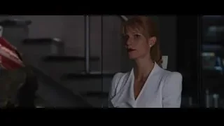 woman standing in front of glass door — Iron Man 3