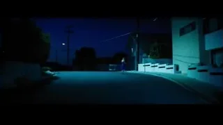 person walking on street at night — La La Land