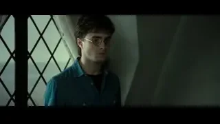 young man standing by window deep in thought — Harry Potter and the Deathly Hallows 2