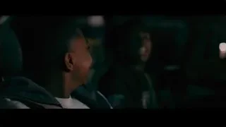 Man laughing in dimly lit room — Creed 3