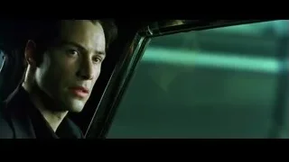 man looking out car window at night city — The Matrix