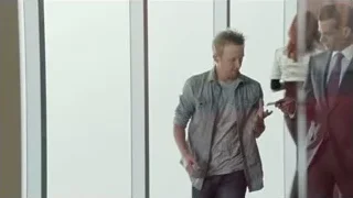 woman walking through glass door — Suits