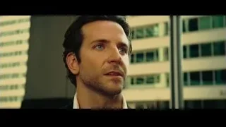 man in suit looking serious in city — Limitless