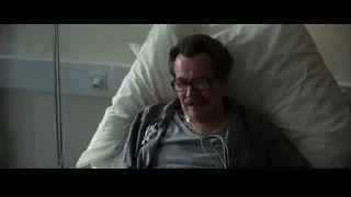 Man lying in hospital bed with stethoscope — Batman: The Dark Knight Rises