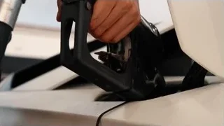 Hand filling car with fuel nozzle — Sports Cars