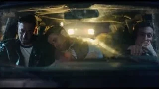 three men sitting in car at night — The Bear