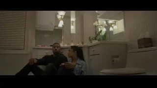 man and woman in kitchen looking concerned — Creed 2