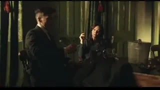 woman with cigarette at wooden table — Peaky Blinders